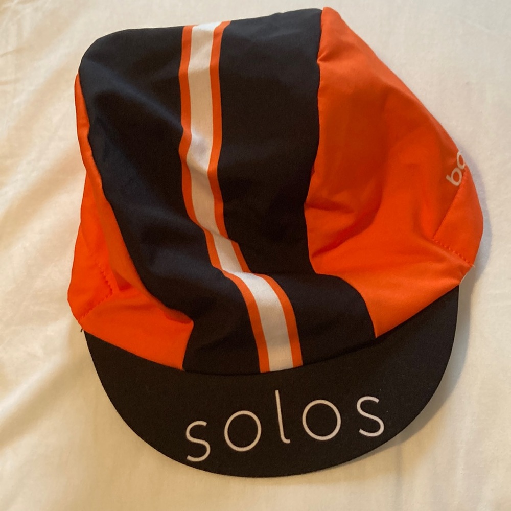 NWOT Solos Orange and Black Cycling Hat